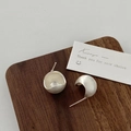 Macro detail of silver plated bean earrings with brushed matte finish and inner textures - Silver Waterdrop Style