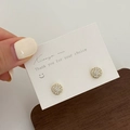 Sparkling pavé cubic zirconia stud earrings with gold plating on display card - Gold