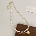 Detail of baroque pearl and gold chain necklace with a mirrored heart pendant - Freshwater Pearl Heart Pendant Gold Necklace / Gold