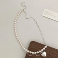 Detail of baroque pearl necklace with heart pendant and metallic fringe accents - Freshwater Pearl Heart Pendant Silver Necklace / Silver
