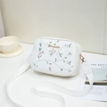 White crossbody camera bag with pink floral embroidery and adjustable strap - White