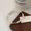 Detailed macro of natural freshwater pearls bracelet with silver textured metal tubes - Silver White Pearl Bracelet