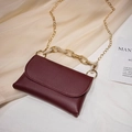 Elegant wine red flap crossbody bag with marble-textured handle and gold chain strap - Red