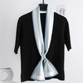 Blue and white striped skinny silk scarf styled on black knitwear for a French chic look - Light Blue Striped