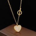 Detail of a gold heart pendant necklace with mother of pearl inlay and stylish OT toggle clasp - Golden Heart Pendant Necklace