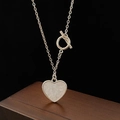 Detail of silver heart pendant necklace with toggle clasp on premium wooden box - Silver Heart Pendant Necklace