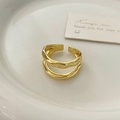 Detail of gold irregular double-layer wave ring with hand-hammered texture finish - Gold