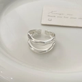 Close-up of irregular silver double-layer wavy ring on a white ceramic tray - Double Layer Irregular Style (C-199) / Silver