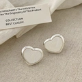 Detailed view of silver heart earrings with iridescent mother of pearl inlay craftsmanship - Silver Heart