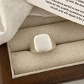 Macro shot of silver matte square signet ring displayed in a premium wooden jewelry box - Brushed Silver