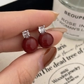 Detailed close-up of French vintage style red pearl earrings with sparkling zircon studs - Silver Red Pearl Earrings / Silver