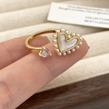 Detail of gold open ring with pearl-framed heart shell and pink heart-shaped zircon - C-328 Gold Pink Zircon Pearl Heart Style