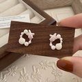 Detailed close-up of pink starfish and white shell stud earrings with delicate pearls - Pink Starfish Earrings