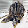 Elegant paisley silk scarf in black and gold hanging on a display stand with accessories - Black Gold Classic Paisley (FE78-1) / 110X110CM