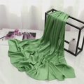 Lightweight grass green pleated chiffon scarf draped on a minimalist display stand - Bean Green (TH35-W20) / 180x70cm