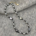 Detail of grey pearl necklace with cat shell pendants and gold lobster clasp - Grey Pearl Cat Necklace