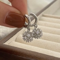 Macro shot of silver snowflake drop earrings featuring sparkling cubic zirconia stones - Silver Fireworks Zirconia Pendant