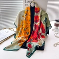 Elegant red and orange floral silk satin scarf with dark green border on display - Red Orange Hand Painted (FE72-1) / 110X110CM