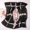 Detailed view of square silk scarf with horse motif and elegant horsebit patterns - 70x70cm / Black