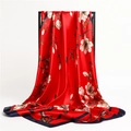 Detailed view of red silk scarf with elegant magnolia flowers and navy blue border - Red & Navy