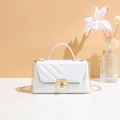 Elegant white crossbody bag with V-shaped quilting and gold metal chain strap - White