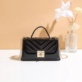 Elegant black patent leather crossbody bag with V-quilted texture and gold chain strap - Black