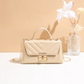 Elegant cream white crossbody bag featuring V-shaped quilting and gold metal chain - Apricot