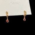 Detail of gold hoop earrings with ruby red pendant displayed on a premium white jewelry card - Rose Red Round Zircon Dangle Earrings