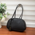 Litchi pattern black semi-circular underarm bag on a wooden table with flowers - Black