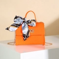 Bright orange felt handbag with gold metal lock, scarf-wrapped handle and chain strap - Orange