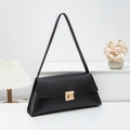 Minimalist black baguette shoulder bag with gold square twist lock on white background - Black