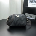 Black quilted crossbody camera bag with white butterfly metal logo and wide strap - Black