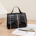 Chic black crocodile embossed flap bag with gold chain strap and tassel detail - Black
