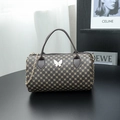 Brown vintage boston bag with golden patterns and a white butterfly metal buckle - Coffee