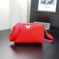 Red quilted camera bag with butterfly ornament and wide nylon shoulder strap - Red