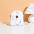 White crossbody phone bag with floral embroidery and cute black cat charm accessory - White