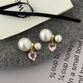 Detailed close-up of pink heart crystal and double pearl earrings on a stylish background - Pink (Pink Zirconia)
