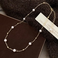 Dettaglio della collana di perle d'acqua dolce con perle dorate, chiusura a moschettone - Collana di Perle Tonde (B-137)