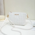 White herringbone woven straw crossbody bag with gold hardware and shoulder strap - White