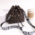 Dark brown bucket bag with heart floral patterns and wide lettered strap - Coffee