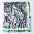 Detailed flat lay of bohemian paisley pattern silk scarf with pink and navy accents - 70*70cm / Green with Pink Border