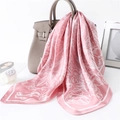 Pink silk scarf with paisley pattern draped over a luxury handbag in a lifestyle setting - 70*70cm / Pink