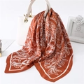 Caramel orange silk scarf with paisley flower print draped on a white leather handbag - 70*70cm / Dark Brown