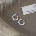 Minimalist matte silver round hoop earrings showcased on a ceramic tray with soft textures - Matte Minimalist Hoop (A-581)