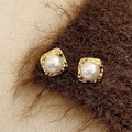 Macro view of square gold hammered earrings with large round white pearl inlays - Gold White Pearl Square Stud Earrings