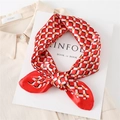 Close-up of red and white plaid silk square scarf styled on a Kinfolk book - 60x60cm / Red