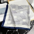 Close-up of geometric striped silk scarf with navy blue borders on marble surface - 70x70cm / White with Navy Border (FJ340-3)