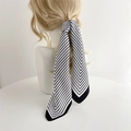 Detail of striped silk scarf tied on a ponytail showcasing a minimalist hair accessory look - 60x60cm / Black Border Stripe (FL8-6)