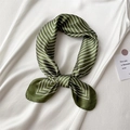 Close-up of a green silk square scarf with white stripes tied on a white dress garment - 60x60cm / Army Green Stripe (FL8-5)