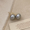 Detail of high-gloss grey pearl earrings on beige knit texture with vintage card - 12mm Grey Pearl Stud Earrings